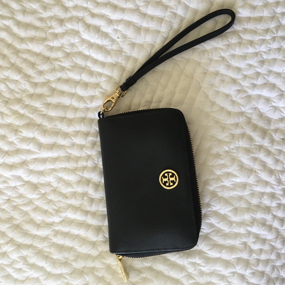 Tory Burch wristlet for phone and $! Never used!